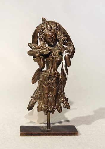 Lot 381 - A West Tibetan fragmentary bronze figure of the four armed deity Chenrezig, 16th/17th century