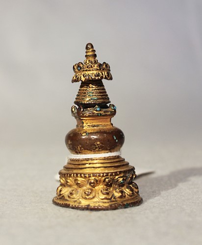 Lot 383 - A Tibetan gilt copper small Stupa, 19th century