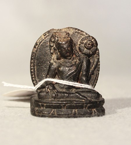 Lot 392 - An Indian/Nepalese carved and polished blackstone tara, seated on a double lotus plinth, 12/13th century or later