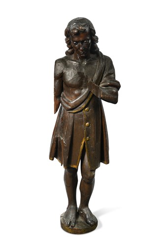 Lot 873 - A carved softwood figure of a man,  possibly 17th century