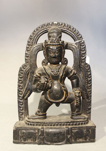 Lot 401 - A Nepalese black stone Kalajambhala Mahakali, 20th century