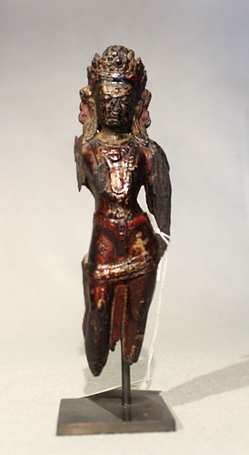 Lot 404 - A Tibetan carved, painted, and lacquered wood Tara fragment, possibly 17th century