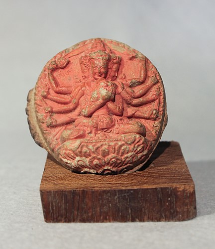 Lot 406 - A Tibetan stucco votive tablet depicting Mahayama with Dakini on a lotus, 19th century
