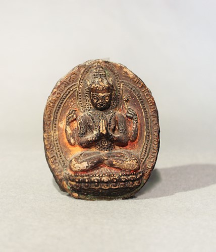 Lot 409 - A Tibetan painted plaster votive plaque depicting Mahakali, probably 19th century