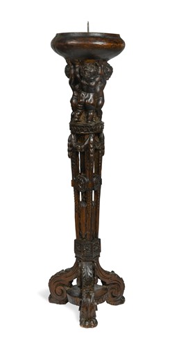 Lot 882 - A late 16th or early 17th century Flemish carved pricket candlestick