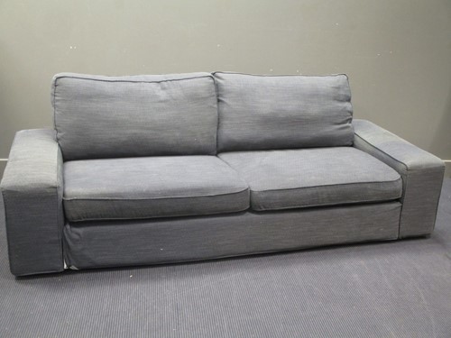 Lot 582 - A contemporary blue upholstered three seater...