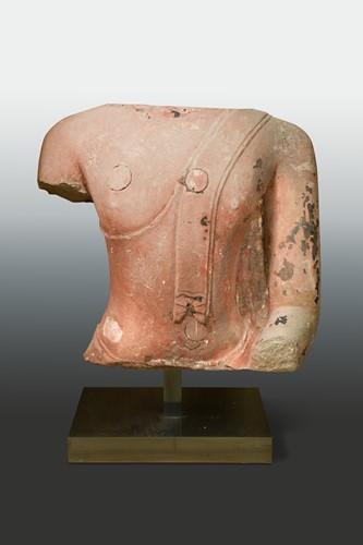 Lot 100 - A large red sandstone torso of Buddha, Thailand Ayutthaya period, 16th/17th century