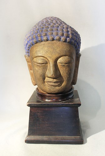 Lot 101 - A carved stone head of a Buddha