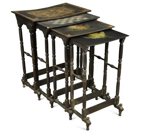 Lot 983 - A nest of four black and gilt lacquer occasional tables