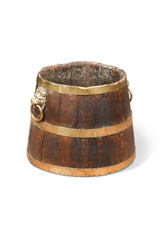Lot 902 - An oak brass bound log bin in half barrel form, early 19th century