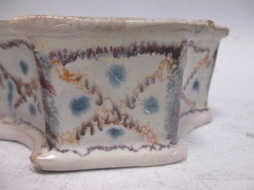 Lot 148 - A French faïence inkwell, of quatrefoil shape,...