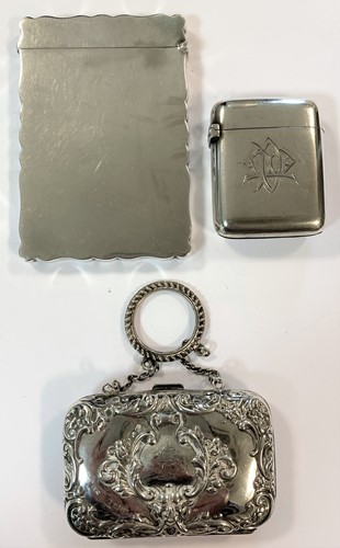 Lot 282 - A silver card case, a silver vesta case by Sampson Mordan and a silver evening coin purse