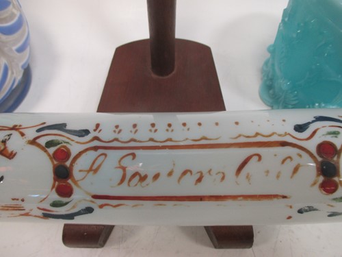 Lot 12 - A Nailsea glass rolling pin, 32cm long; a blue...