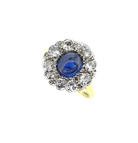 Lot 178 - A star sapphire and diamond cluster ring