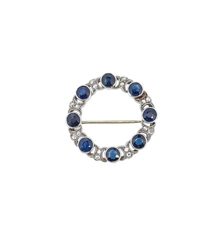 Lot 172 - A Swedish metalwares 18ct circle brooch set with sapphires and diamonds