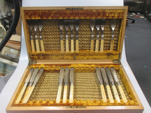 Lot 192 - A part canteen of silver plated fish eaters, a...