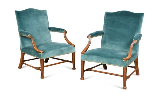 Lot 254 - A pair of George III mahogany Gainsborough open armchairs