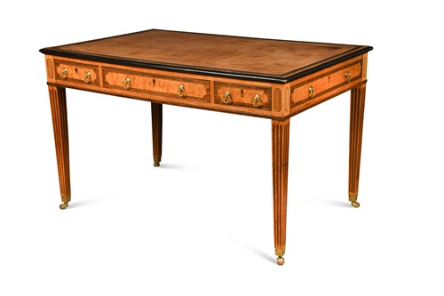 Lot 372 - A George III satinwood writing table in the manner of Mayhew and Ince