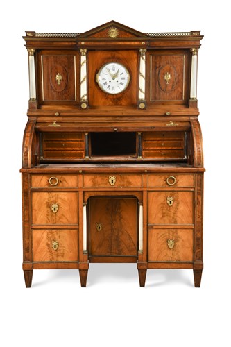 Lot 250 - An Empire mahogany cylinder bureau and clock cabinet