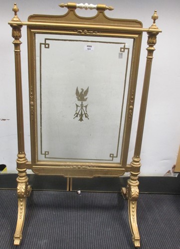 Lot 503 - A gilt fire screen with glazed panel