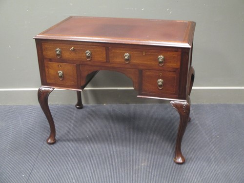 Lot 624 - A Georgian style line inlaid mahogany writing...