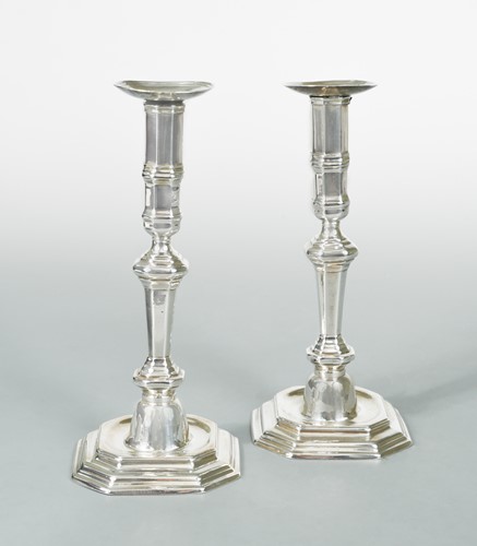 Lot 327 - A pair of continental metalwares cast candlesticks