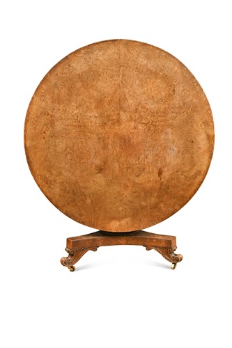 Lot 322 - A late Regency pollard oak circular table