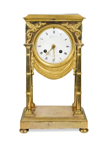 Lot 273 - A French Empire ormolu and gilt metal mantel clock