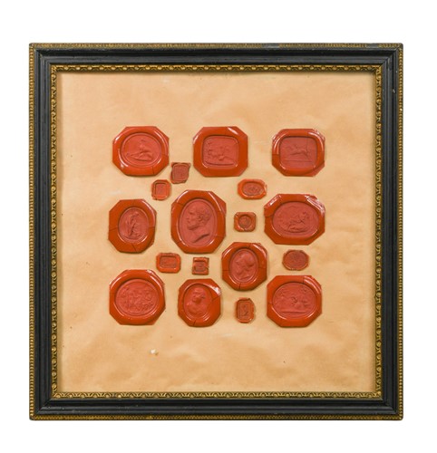 Lot 227 - A framed collection of 40 Grand Tour red wax portrait intaglios, 19th century