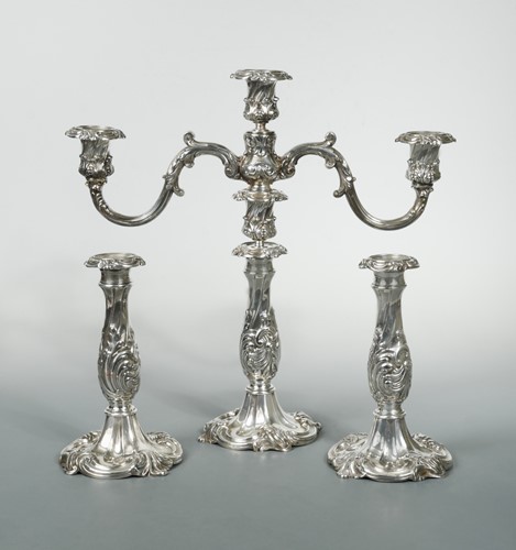 Lot 307 - An American silver plated three light candelabra together with a matching pair of candlesticks