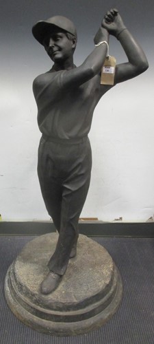 Lot 130 - A cast iron figure of a golfer, on stepped...