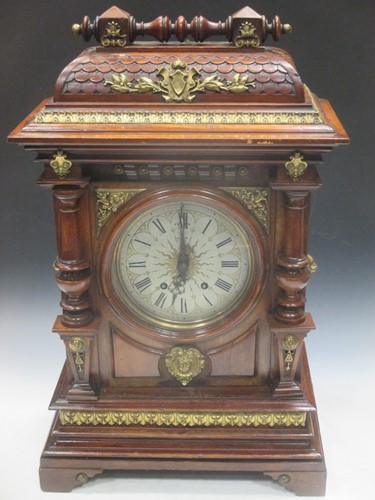 Lot 135 - A walnut mantel clock, 70cm high