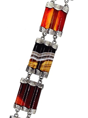 Lot 1 - An agate bracelet and two brooches in the Scottish style