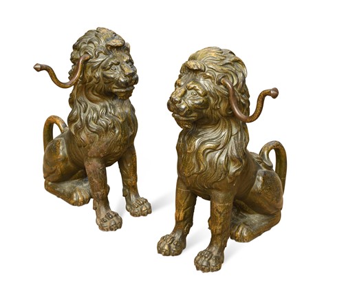 Lot 188 - A pair of painted cast iron seated lion firedogs, 20th century