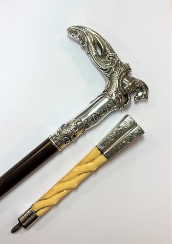 Lot 278 - A late 19th century silver topped walking stick and parasol handle