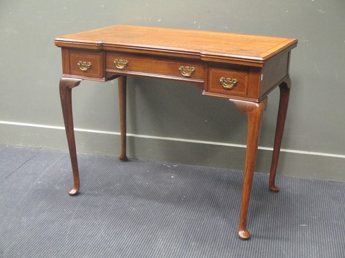 Lot 414 - An early 19th century walnut breakfront card/...