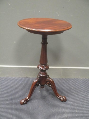 Lot 413 - Circa 1850 a mahogany circular top wine table...