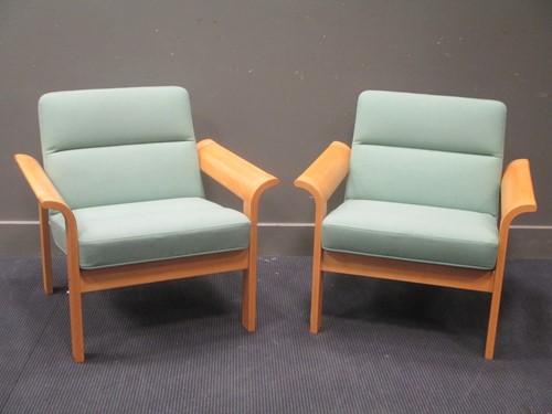 Lot 604 - A pair of Magnus Oleson Danish arm chairs (2)