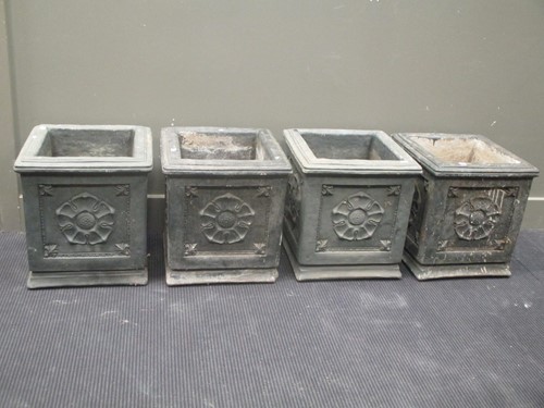 Lot 421 - A set of four painted concrete planters with...