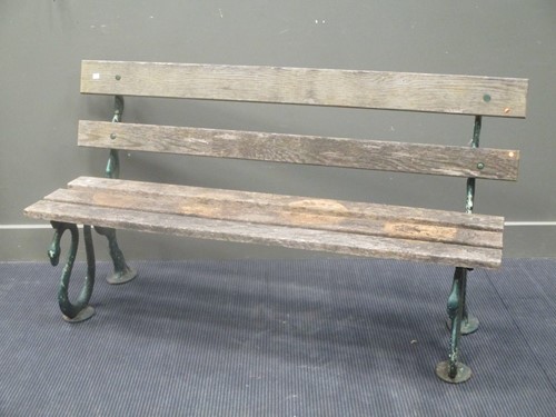 Lot 423 - A green painted cast iron 'serpent' pattern...