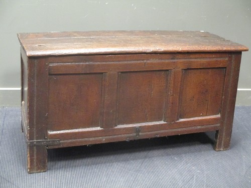 Lot 615 - An 18th century oak coffer with three panelled...