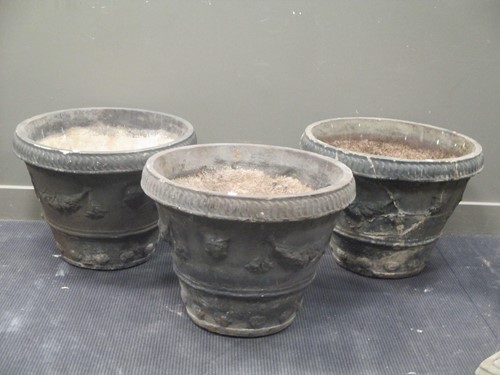 Lot 422 - A set of three painted composite circular...
