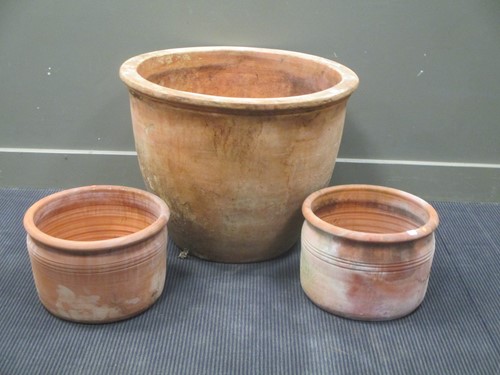 Lot 424 - A large plain terracota circular planter, 69cm...