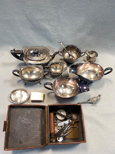 Lot 184 - A silver three piece tea set together with a...