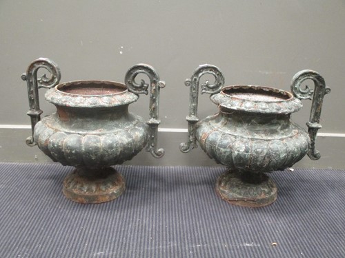 Lot 437 - A pair of metal two handles garden urns with...