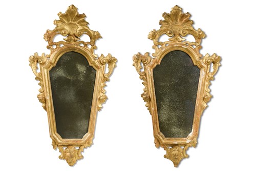 Lot 294 - A pair of late 18th or early 19th century Venetian gilt wood wall mirrors