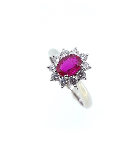 Lot 150 - A ruby and diamond cluster ring