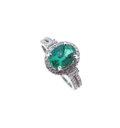 Lot 208 - An 18ct gold emerald and diamond halo style cluster ring