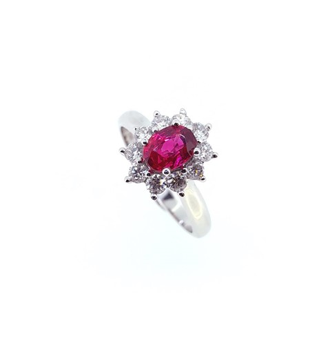 Lot 148 - An 18ct gold ruby and diamond cluster ring