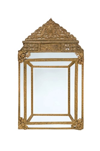 Lot 191 - A Dutch pressed brass, cushion framed wall mirror, late 19th century